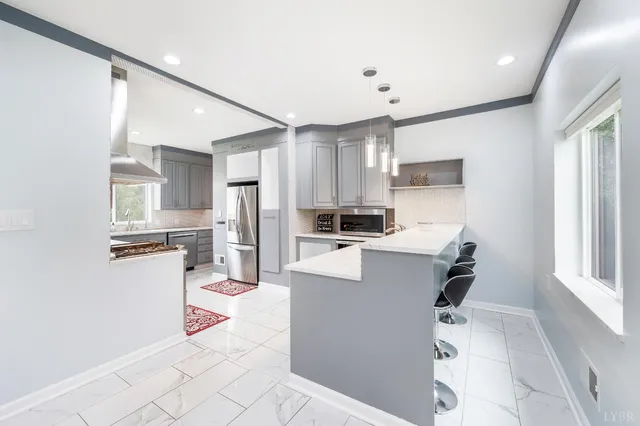 a bedroom with a large bed and a large window