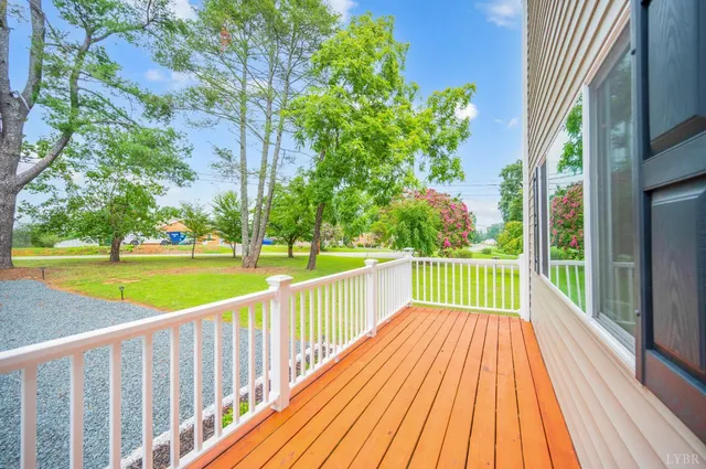 a view of balcony with wooden floor and fence