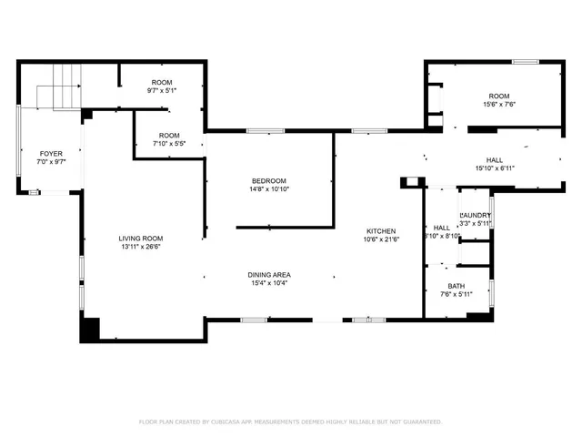 a view of a patio with couches chairs and a floor to ceiling window