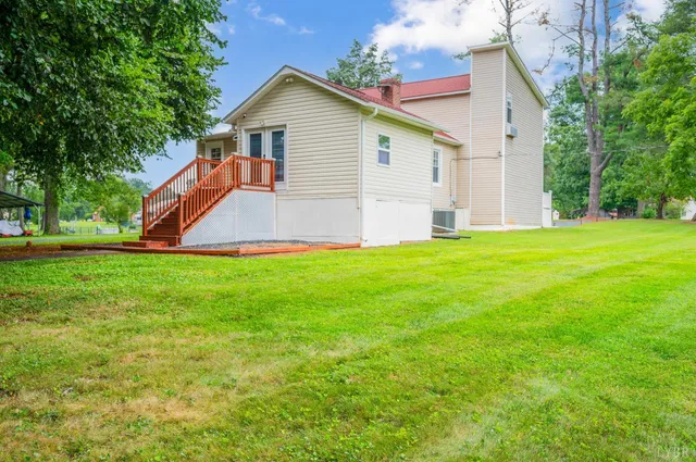 a living room with furniture a wooden floor and a large window