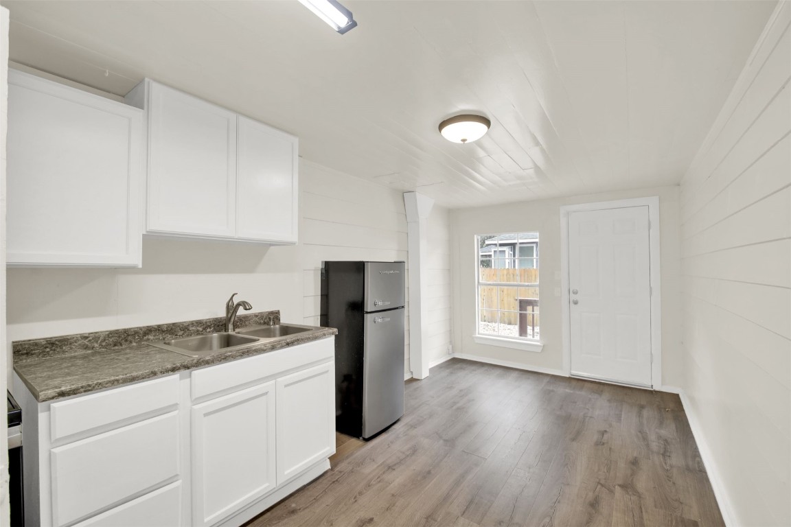 4010 Speedway, Unit D Austin, TX 78751 - Photo 12 of 14 a kitchen with a refrigerator and cabinets