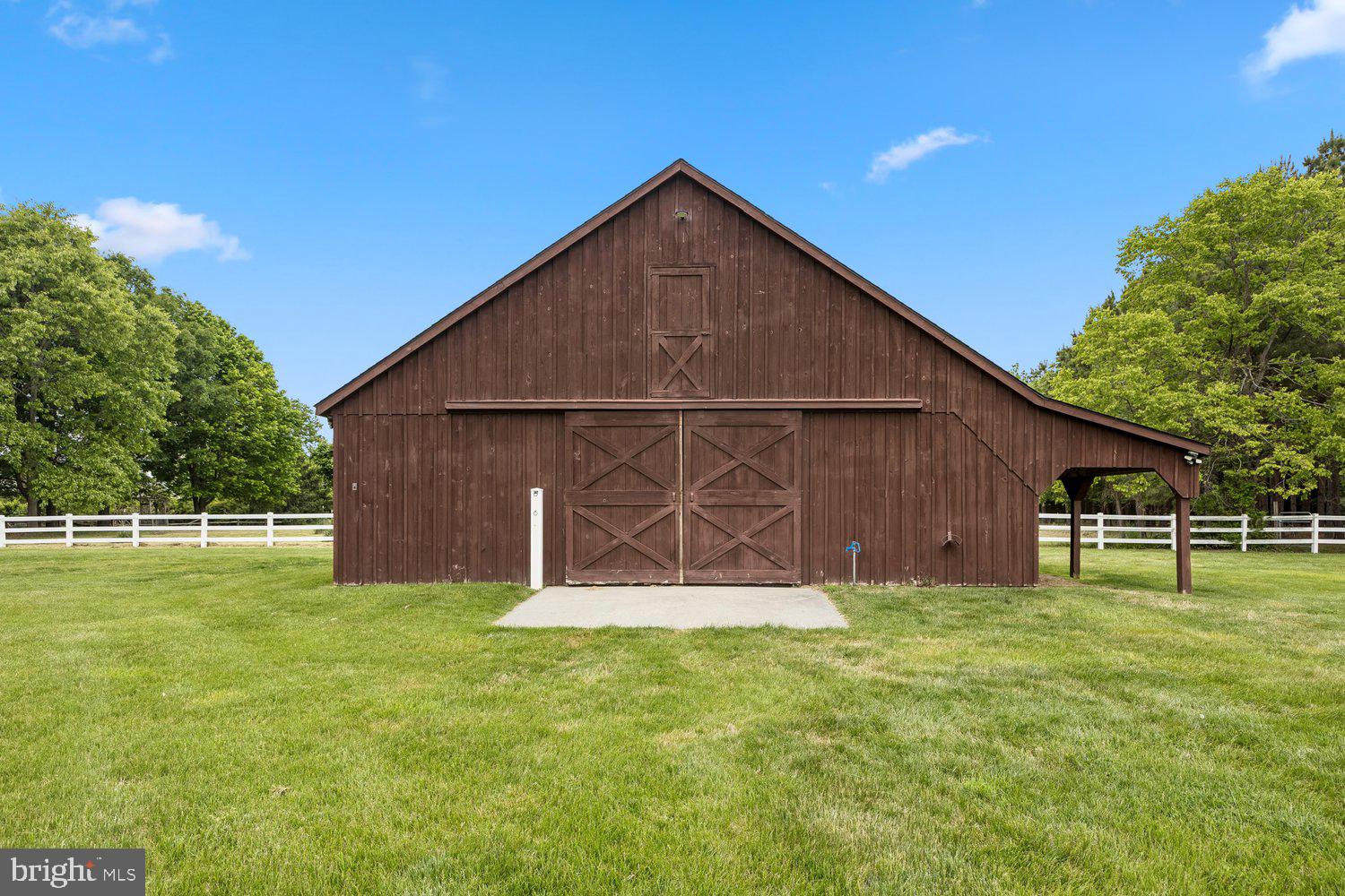 313 Wye Road Queenstown, MD 21658 - Photo 110 of 132 Charming rustic barn amidst lush greenery.