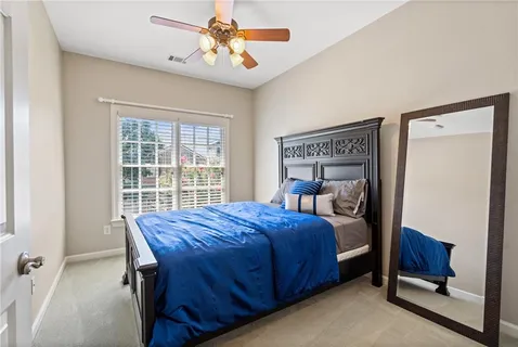 a bedroom with a bed and a table