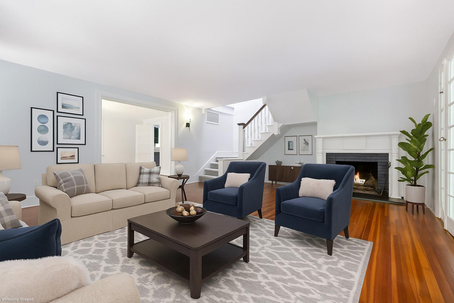 a living room with furniture and a fireplace