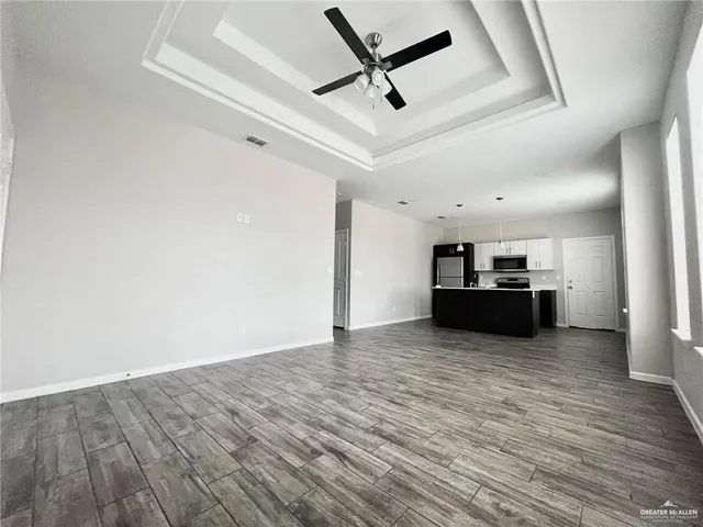 a view of kitchen and wooden floor