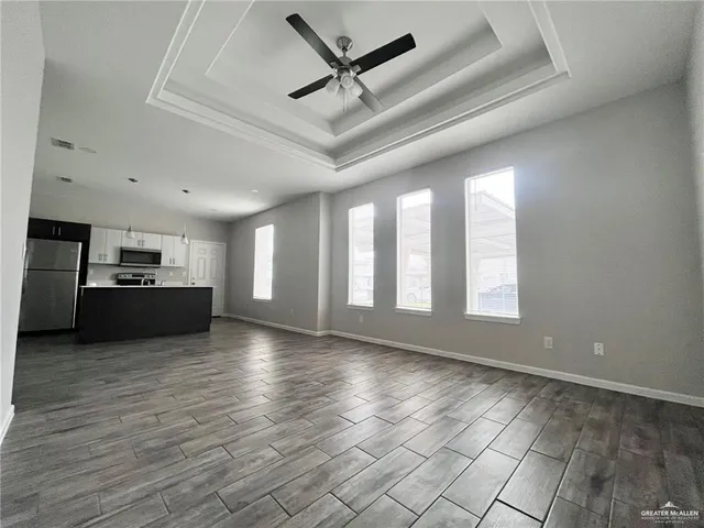 a view of kitchen with cabinets and wooden floor