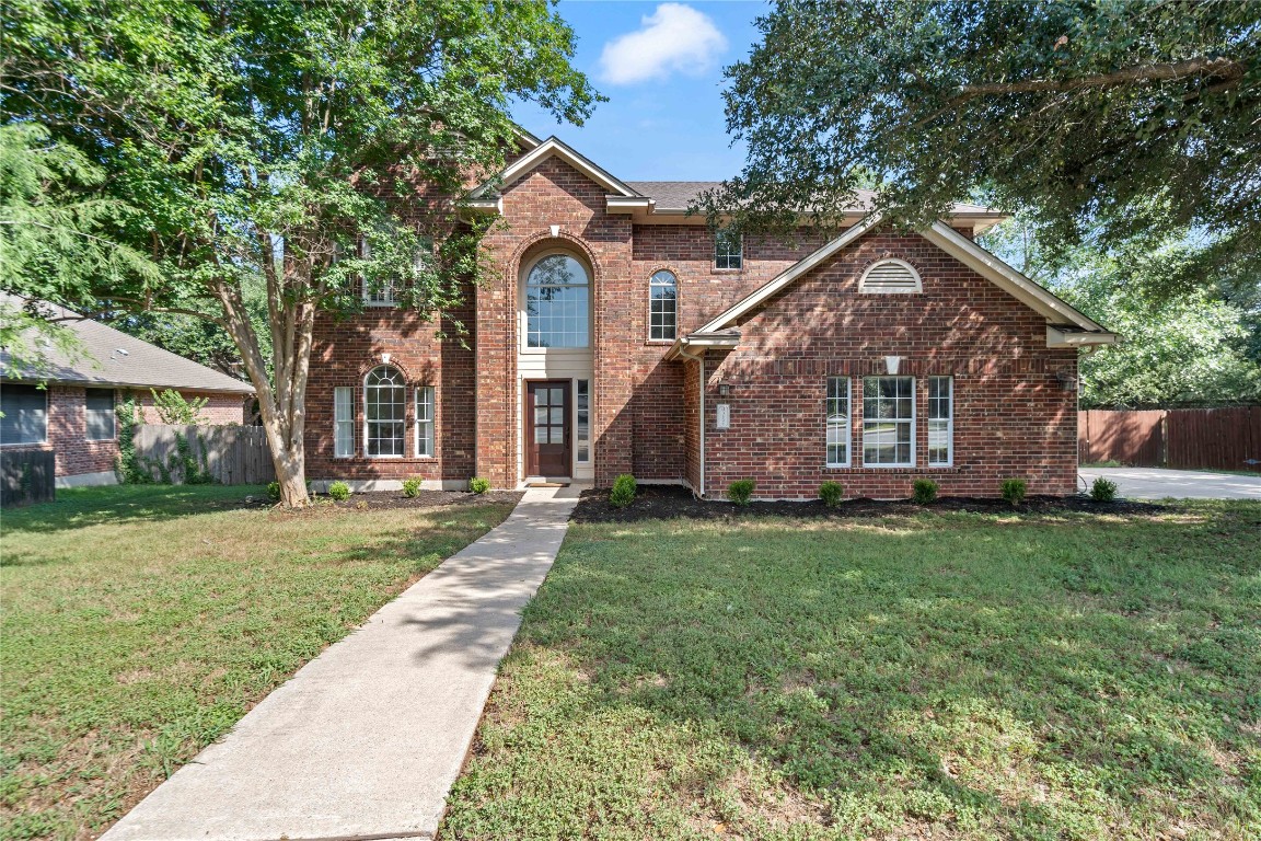 a front view of a house with a yard