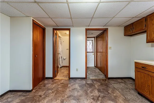 a bathroom with a sink and mirror with toilet
