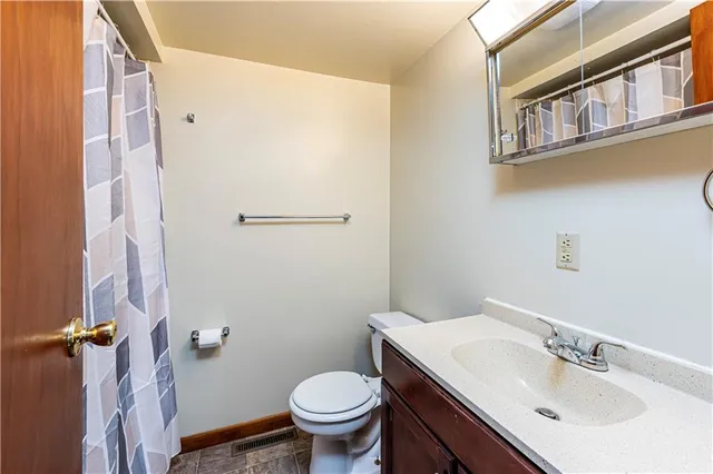 a view of empty room with ceiling fan