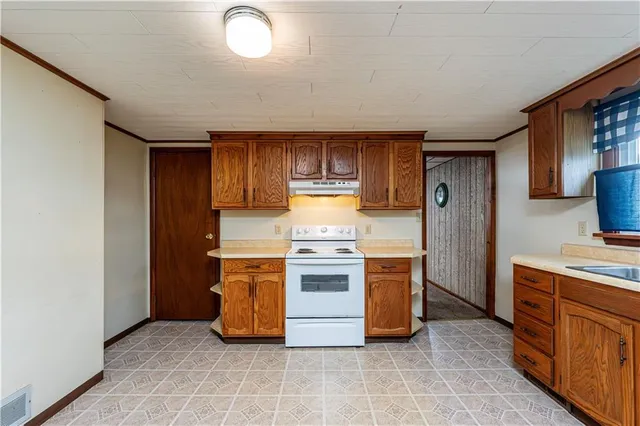 a view of empty room with windows