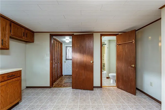 a view of empty room with wooden walls