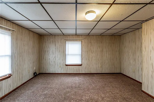 a view of a wooden deck with a yard