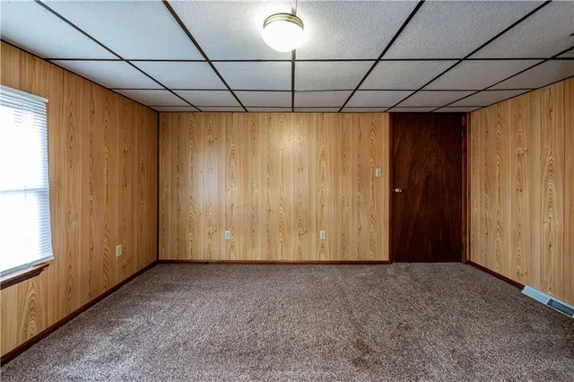 a view of a house with a yard and staircase