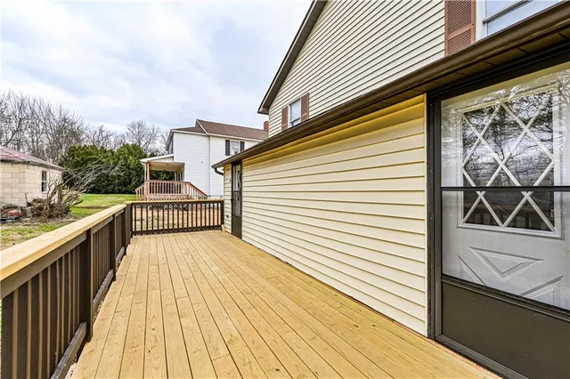 an aerial view of residential houses with outdoor space and swimming pool