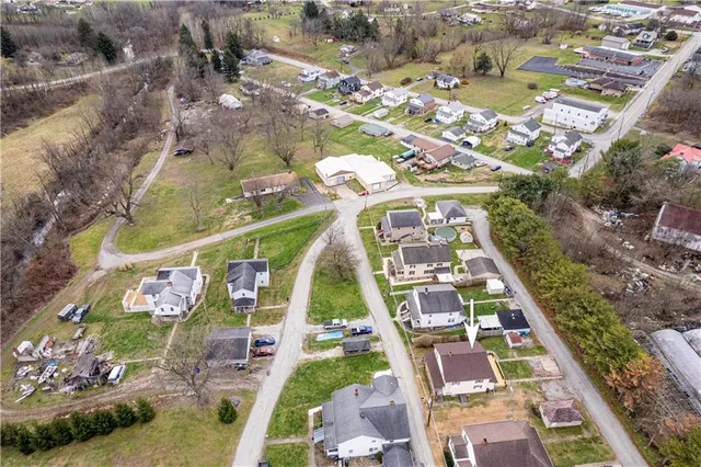 a view of a house with a yard patio and sitting area