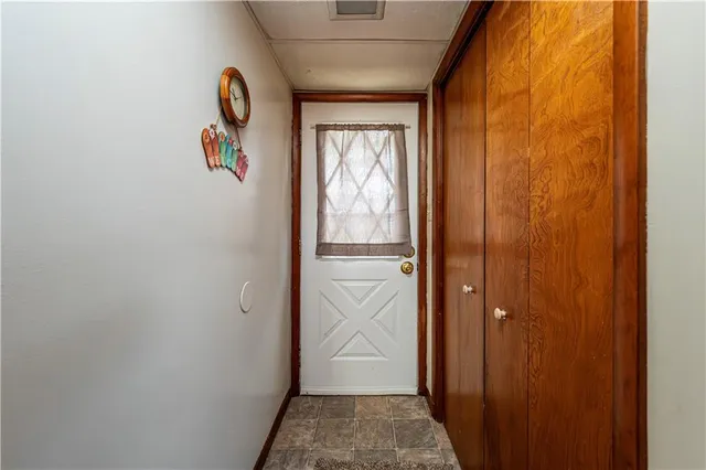 a view of a kitchen with stainless steel appliances granite countertop a stove and a refrigerator