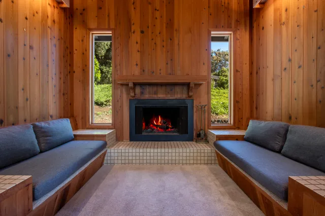 a bedroom with a bed and large window