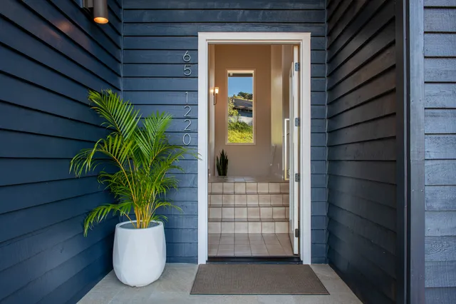 a large kitchen with granite countertop a sink and a stove