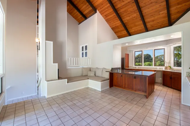 a kitchen with stainless steel appliances granite countertop a sink and a refrigerator