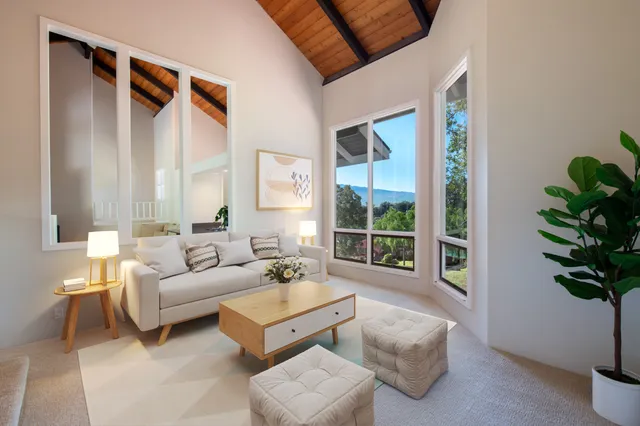 a view of an empty room with windows