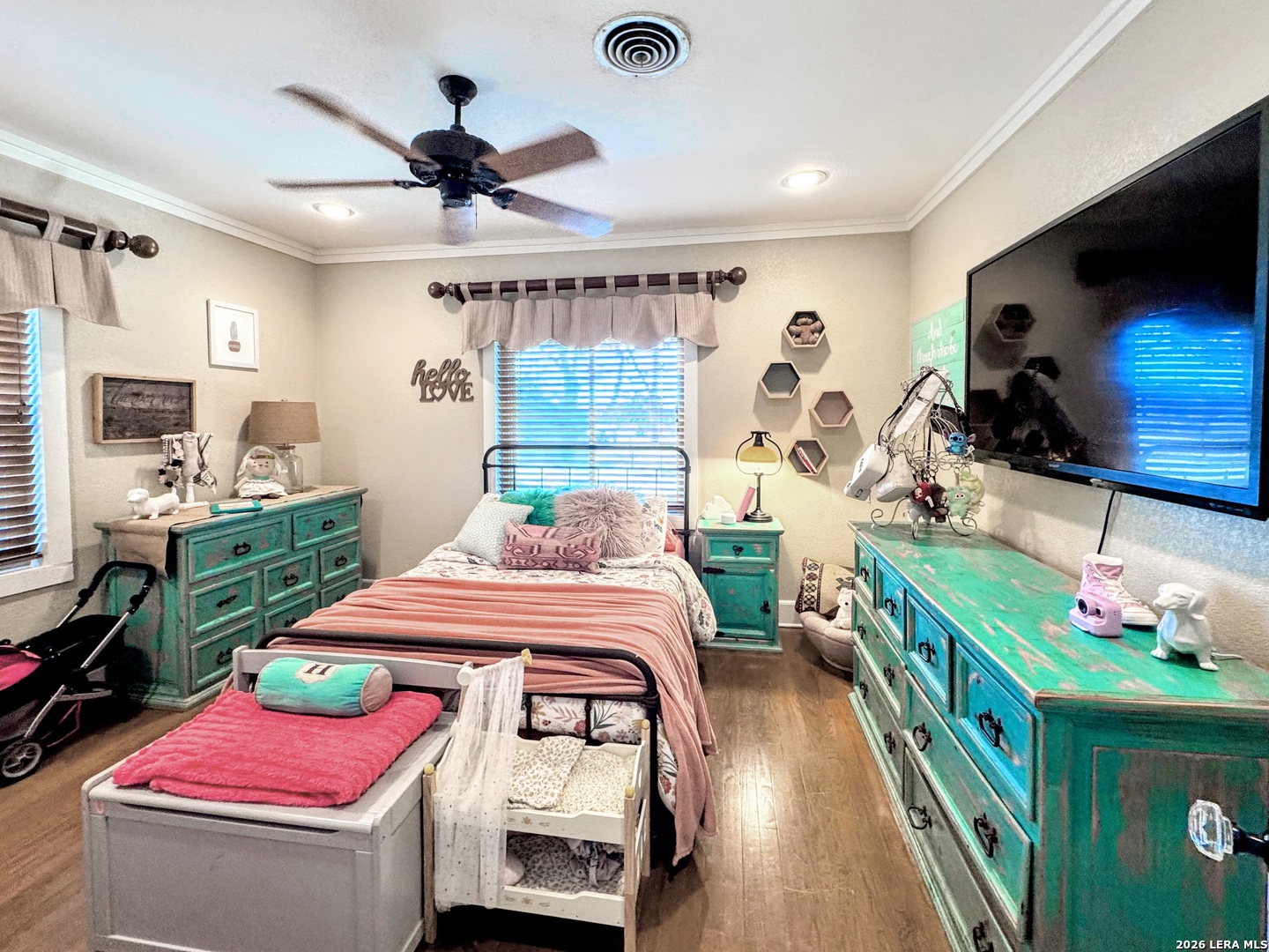 2828 2nd Street Pleasanton, TX 78064 - Photo 21 of 48 a bedroom with furniture and a flat screen tv