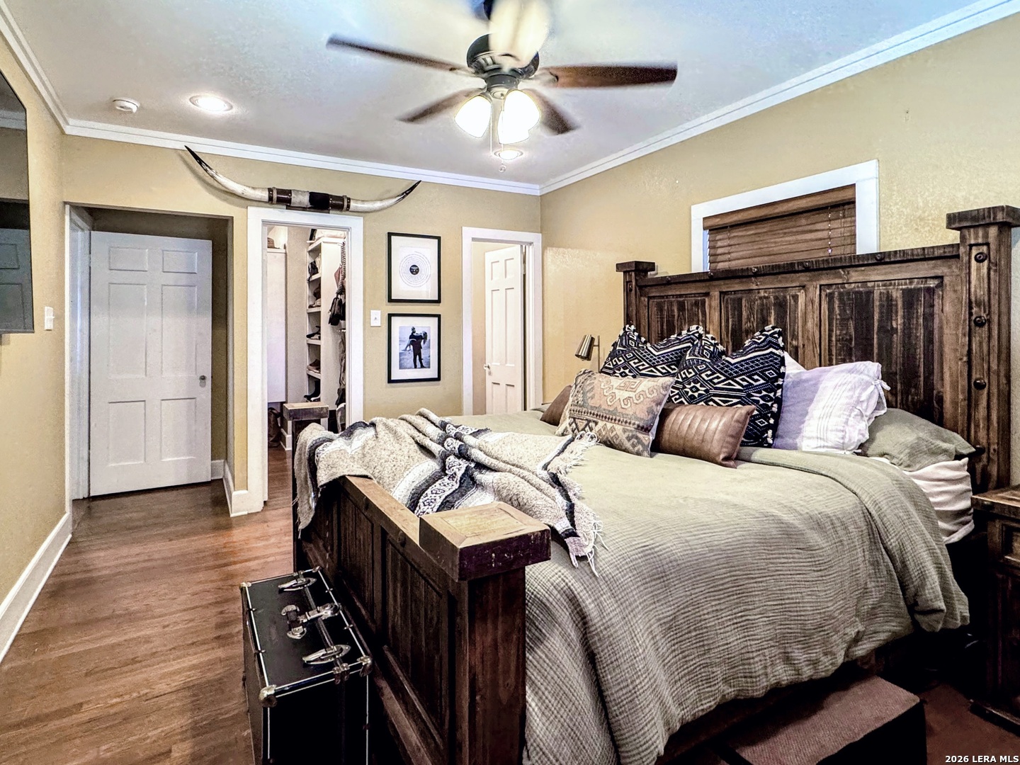 2828 2nd Street Pleasanton, TX 78064 - Photo 25 of 48 a bedroom with a bed and wooden floor