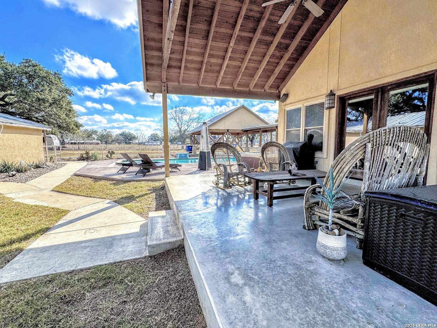 2828 2nd Street Pleasanton, TX 78064 - Photo 29 of 48 a view of a swimming pool with outdoor seating