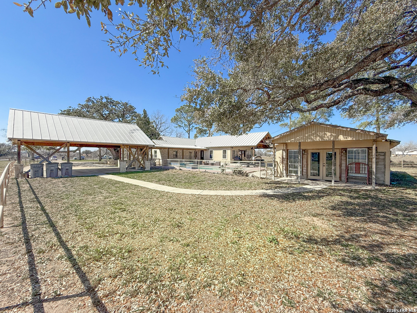 2828 2nd Street Pleasanton, TX 78064 - Photo 33 of 48 a front view of a house with a garden