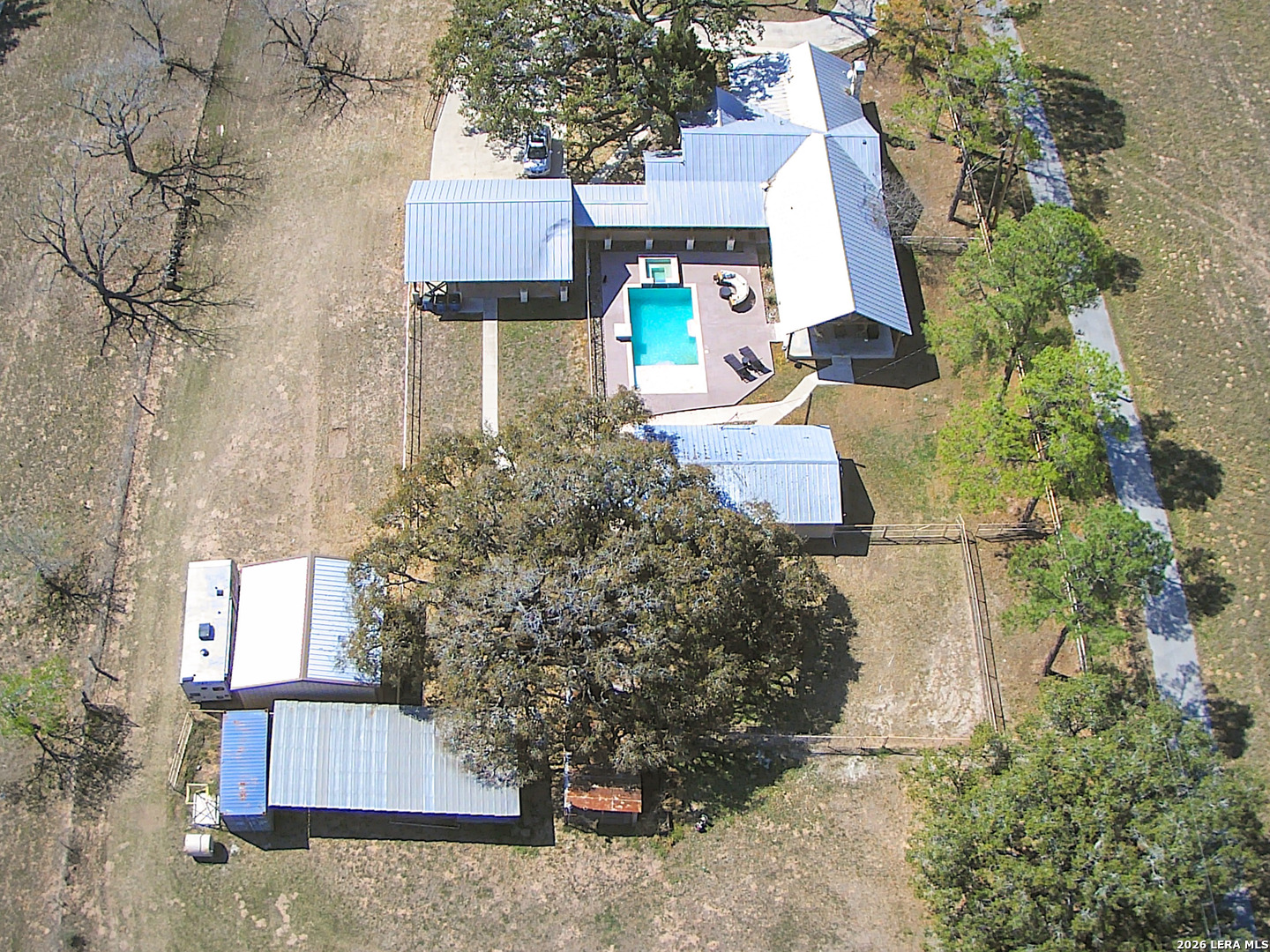 2828 2nd Street Pleasanton, TX 78064 - Photo 40 of 48 a view of a brick house with a yard and large trees