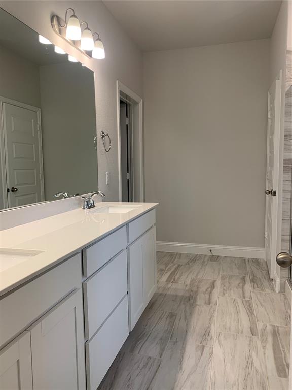 765 Knoxbridge Road Forney, TX 75126 - Photo 15 of 22 a bathroom with a sink vanity and a mirror