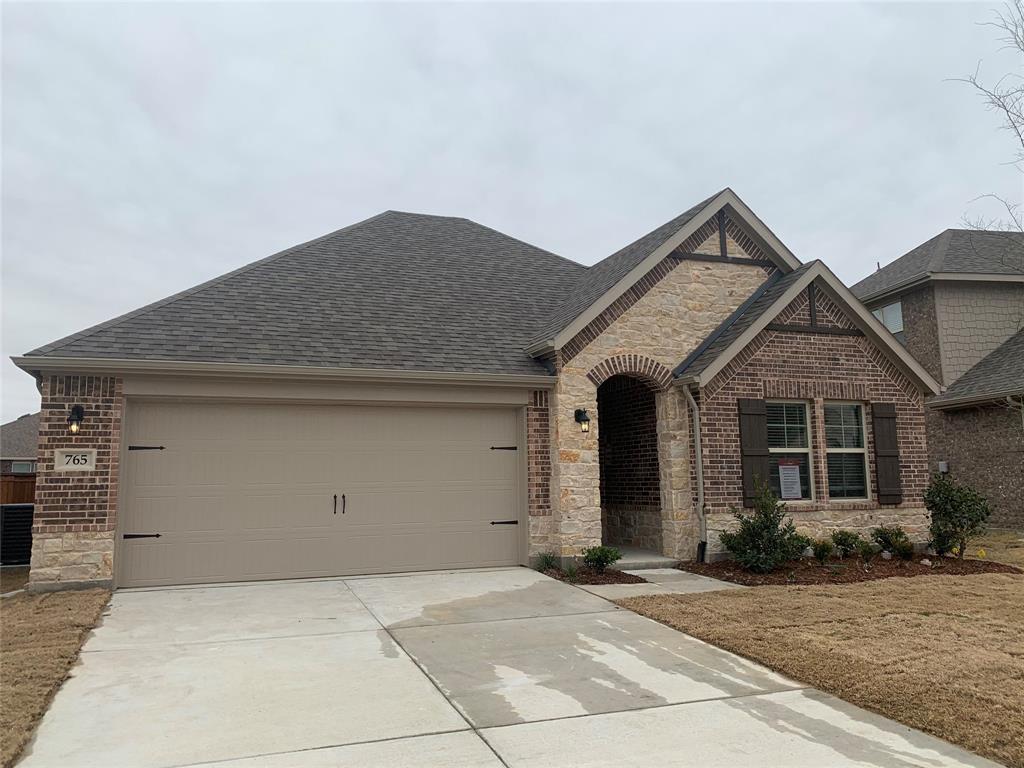 765 Knoxbridge Road Forney, TX 75126 - Photo 2 of 22 a front view of a house with yard