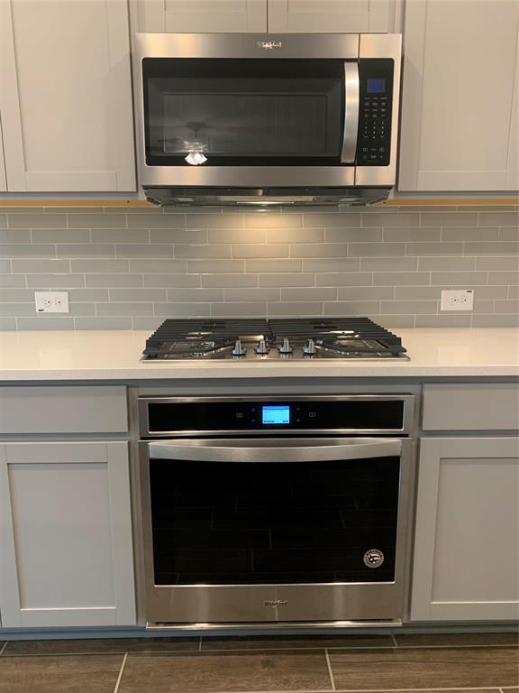765 Knoxbridge Road Forney, TX 75126 - Photo 8 of 22 a stove top oven sitting inside of a kitchen