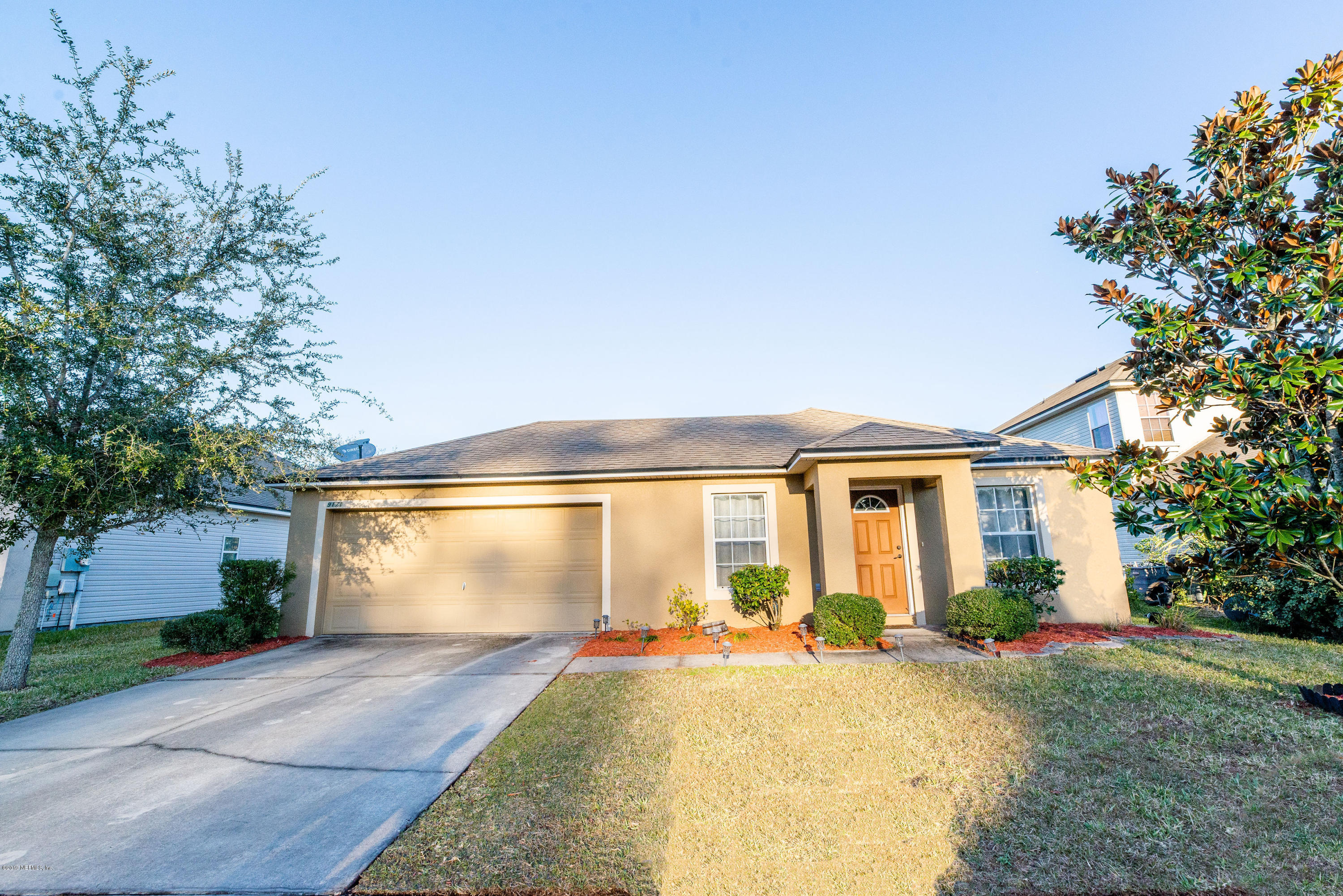 front view of a house with a yard