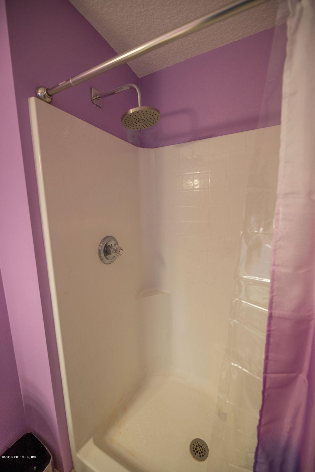 9171 Raptor Drive Jacksonville, FL 32221 - Photo 11 of 13 a bathroom with a shower