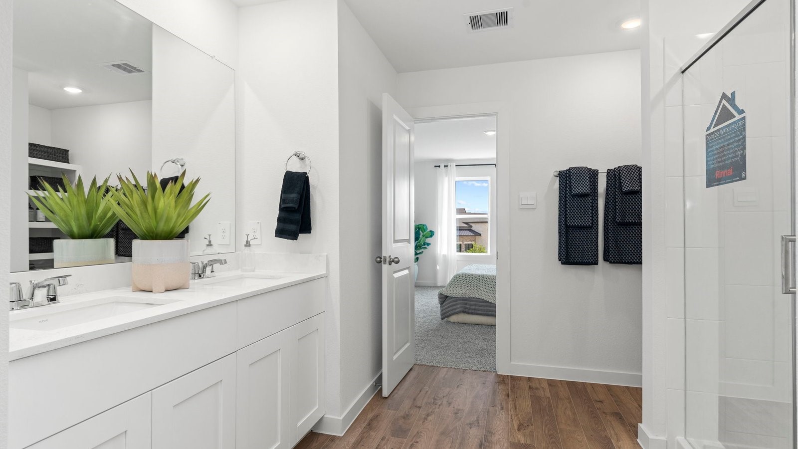 3547 Blue Mockingbird Street Katy, TX 77494 - Photo 27 of 42 a bathroom with a granite countertop sink and a mirror