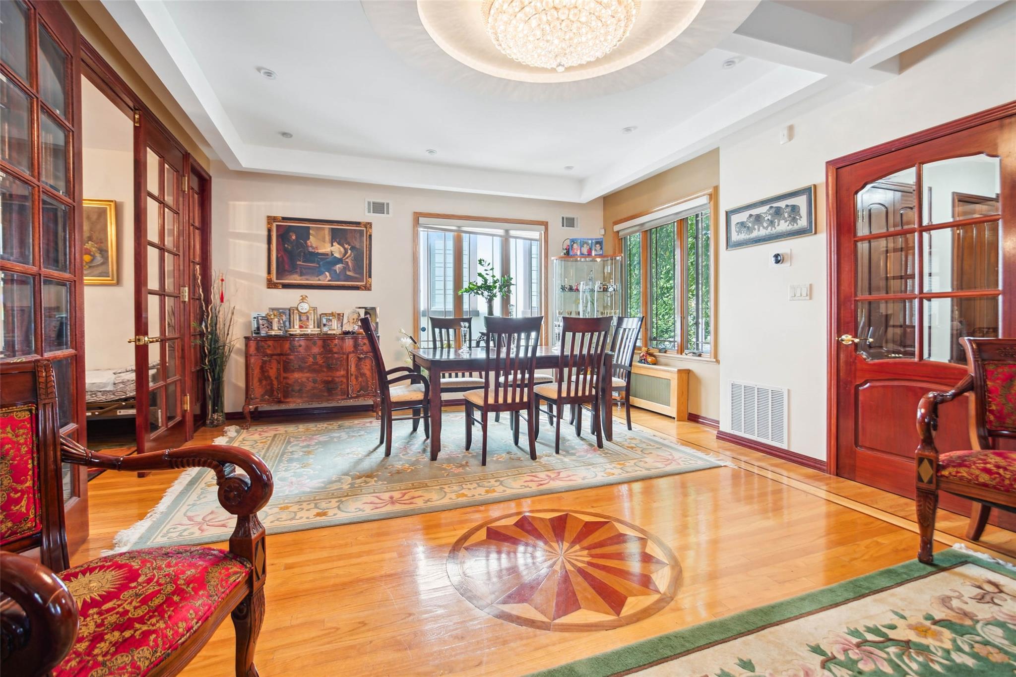 71-38 Harrow Street Queens, NY 11375 - Photo 1 of 1 a living room with furniture and a floor to ceiling window