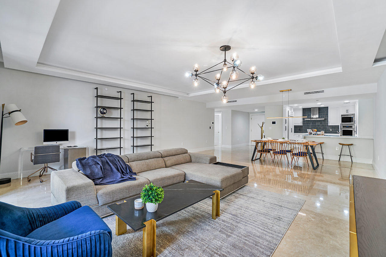 200 East Palmetto Park Road, Unit 410 Boca Raton, FL 33432 - Photo 13 of 44 a living room with furniture and wooden floor