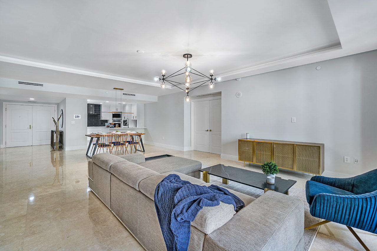 200 East Palmetto Park Road, Unit 410 Boca Raton, FL 33432 - Photo 14 of 44 a living room with furniture and a chandelier