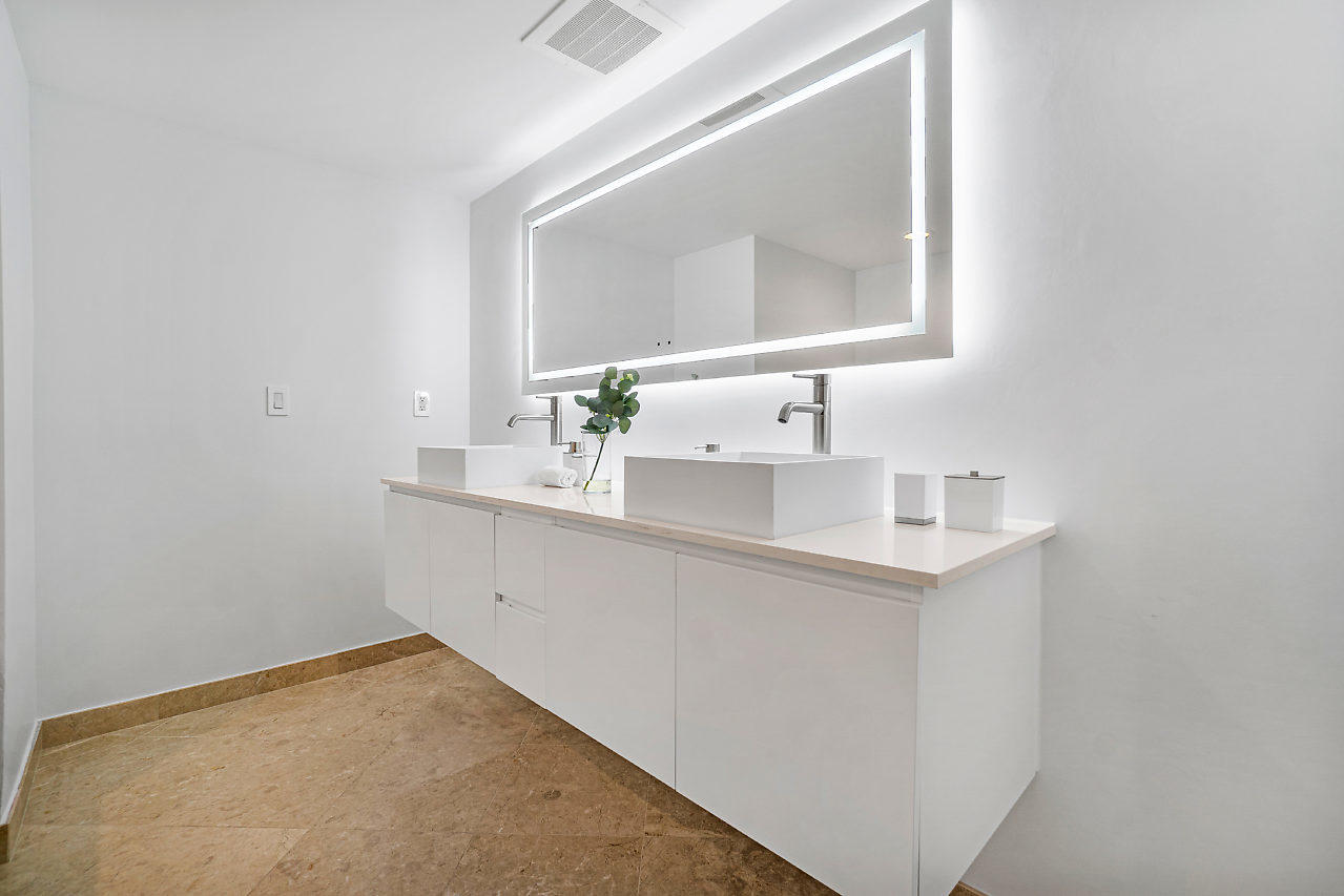 200 East Palmetto Park Road, Unit 410 Boca Raton, FL 33432 - Photo 23 of 44 a bathroom with a sink vanity and a mirror