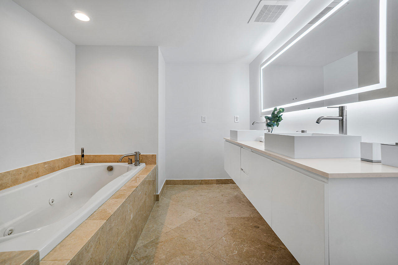 200 East Palmetto Park Road, Unit 410 Boca Raton, FL 33432 - Photo 24 of 44 a bathroom with a bathtub and a sink