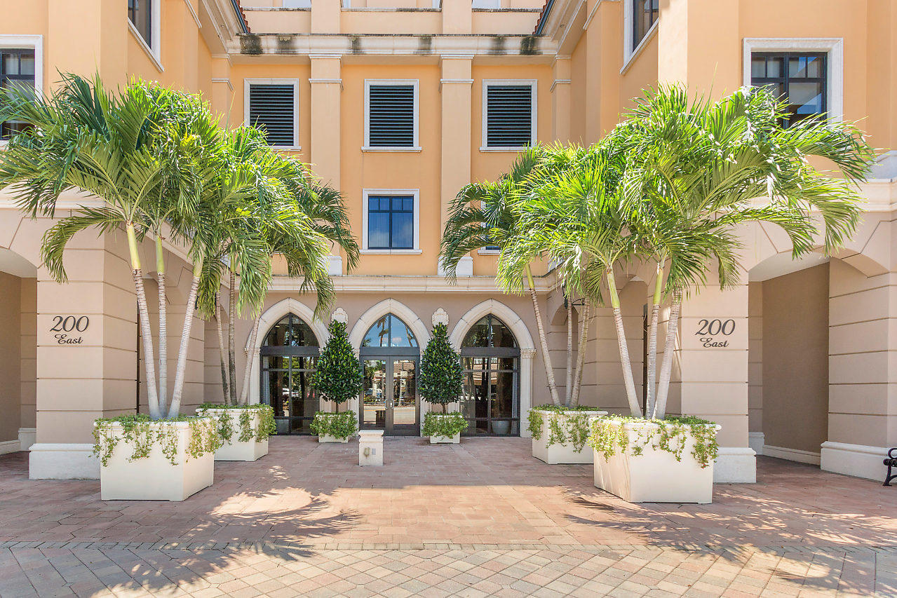 200 East Palmetto Park Road, Unit 410 Boca Raton, FL 33432 - Photo 3 of 44 a view of a white building with potted plants in front of house