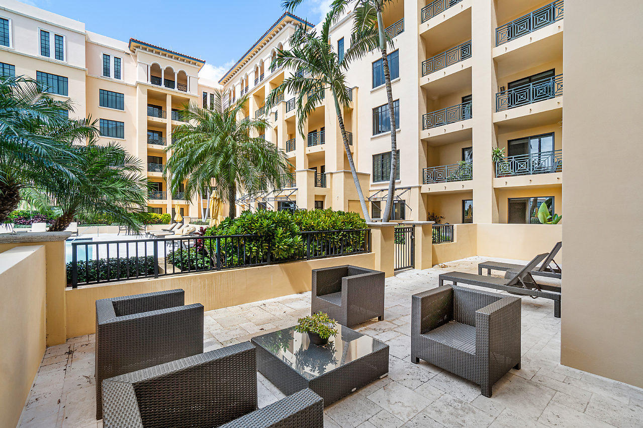200 East Palmetto Park Road, Unit 410 Boca Raton, FL 33432 - Photo 31 of 44 a view of a patio with couches and a potted plant on a table
