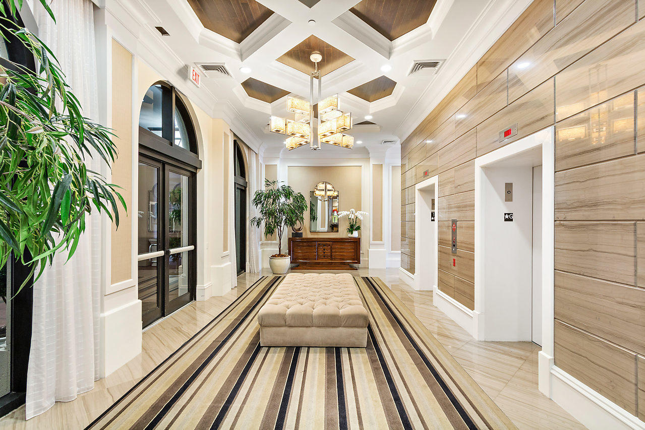 200 East Palmetto Park Road, Unit 410 Boca Raton, FL 33432 - Photo 32 of 44 a view of a hall with wooden floor