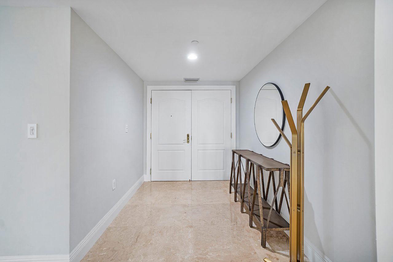 200 East Palmetto Park Road, Unit 410 Boca Raton, FL 33432 - Photo 4 of 44 a view of a hallway with entryway
