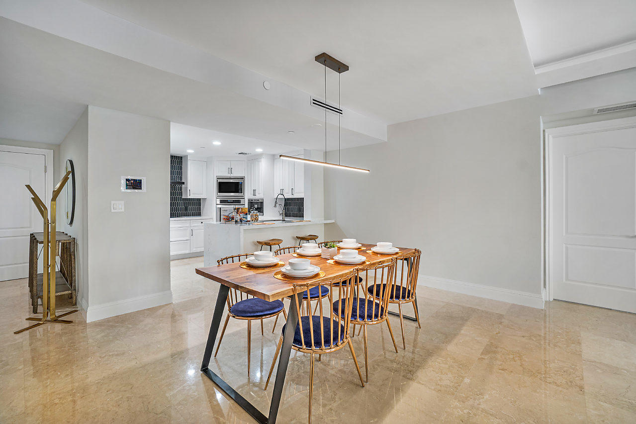 200 East Palmetto Park Road, Unit 410 Boca Raton, FL 33432 - Photo 5 of 44 a view of a dining room with furniture