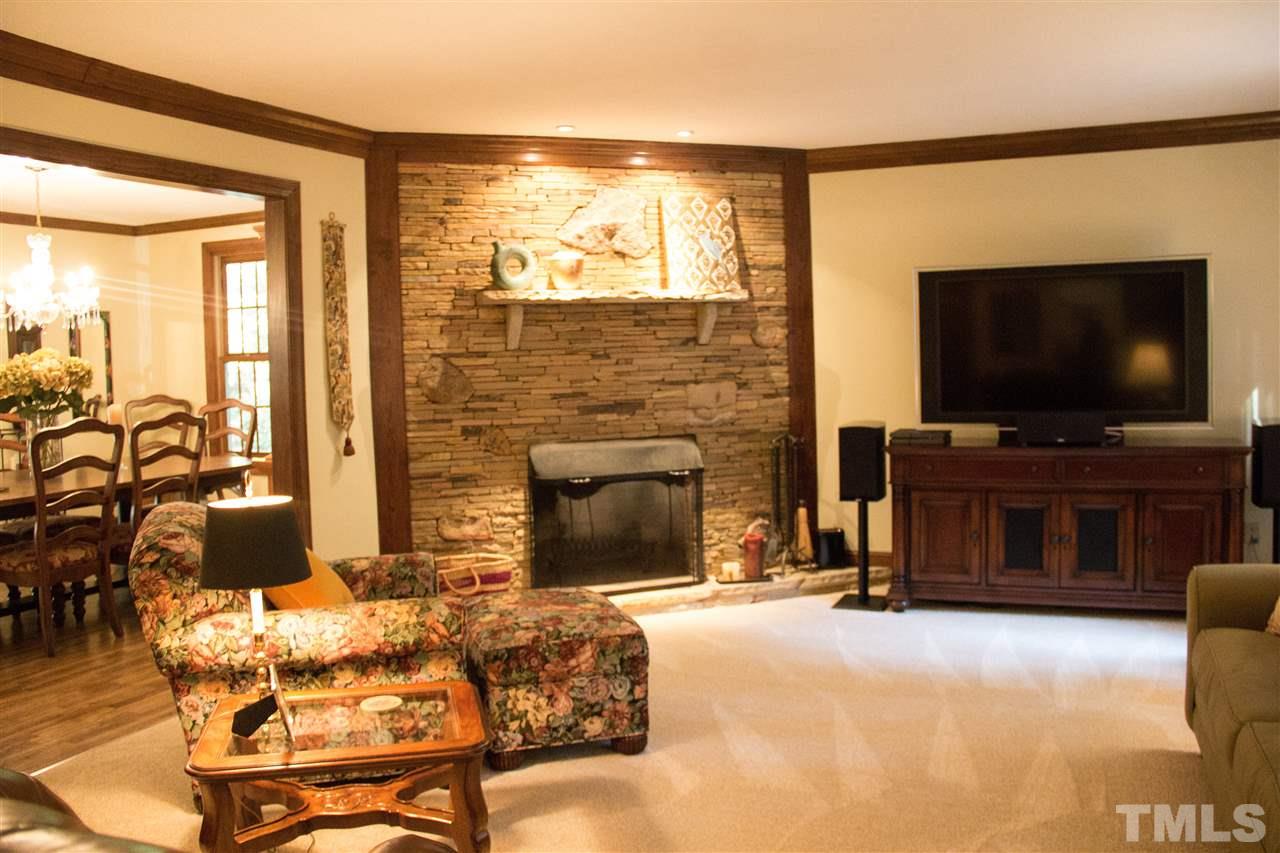 2500 Saddleridge Drive Raleigh, NC 27615 - Photo 5 of 25 a living room with fireplace furniture and a flat screen tv