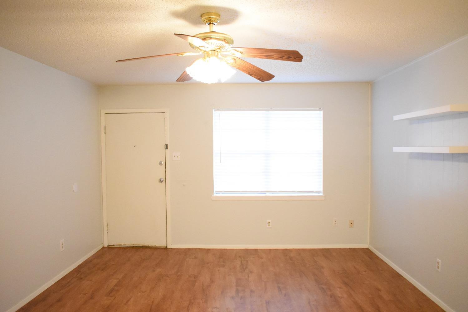3414 Nashville Avenue, Unit C Lubbock, TX 79413 - Photo 2 of 8 an empty room with a window