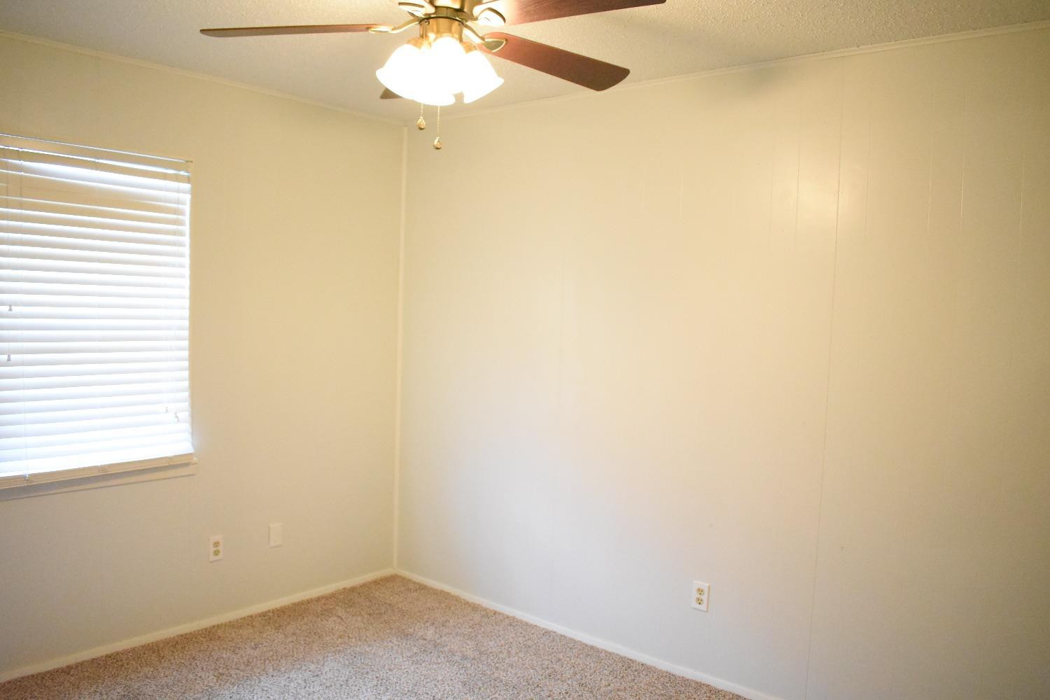 3414 Nashville Avenue, Unit C Lubbock, TX 79413 - Photo 5 of 8 an empty room with a window