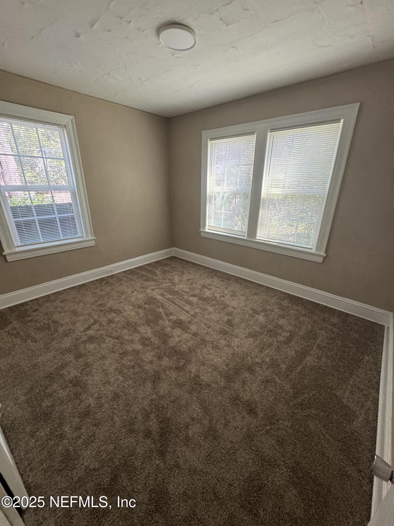 2056 Post Street, Unit 1 Jacksonville, FL 32204 - Photo 9 of 10 an empty room with windows