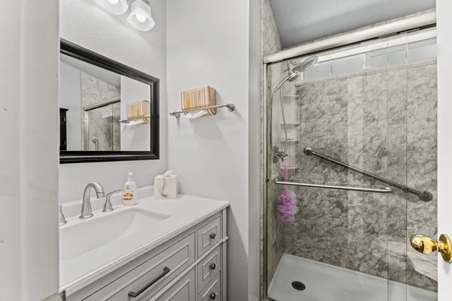 a bathroom with a sink and a mirror